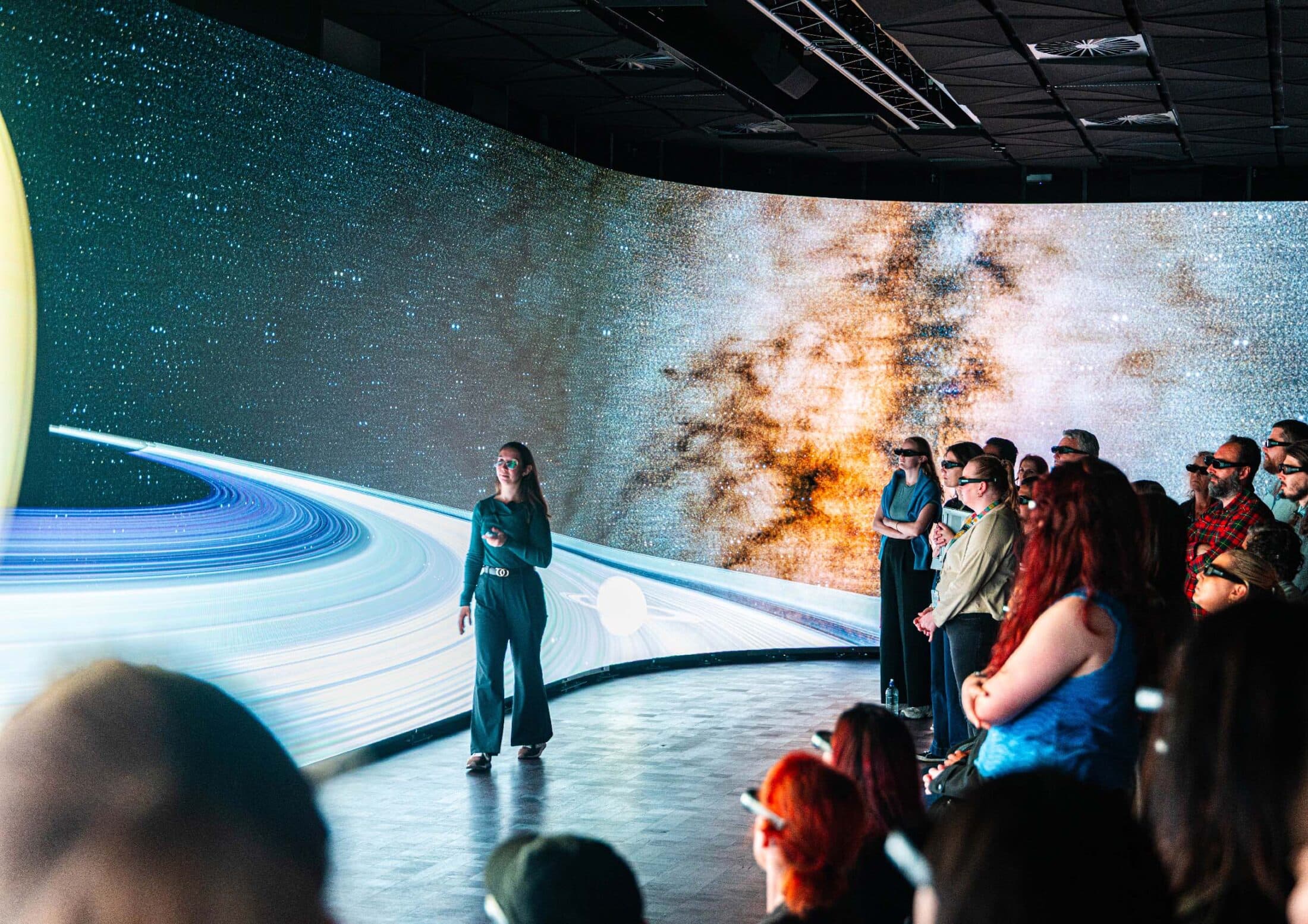 Host presenting to audience inside the SVU